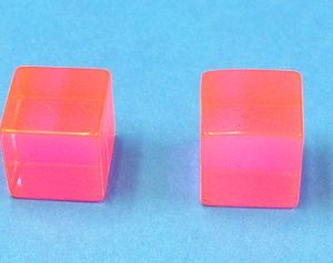 Pinkish Plastic Cubes For 2 in the Hand 1 in the Pocket Trick