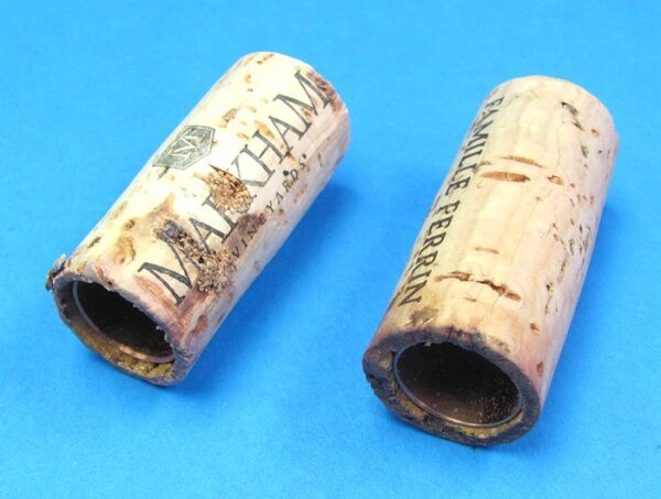 pair of hollow corks for coin in bottle trick #1 2