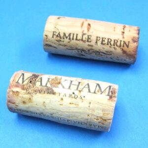 pair of hollow corks for coin in bottle trick #1