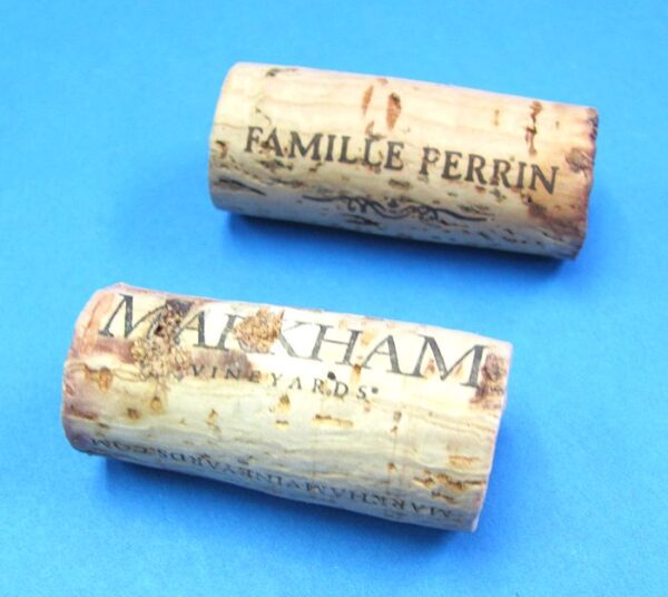 pair of hollow corks for coin in bottle trick #1