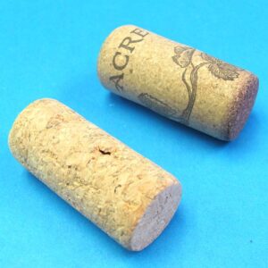 pair of hollow corks for coin in bottle trick #2