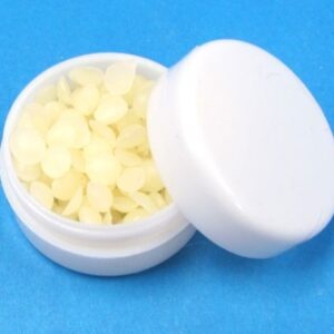 magician's wax in small white plastic container