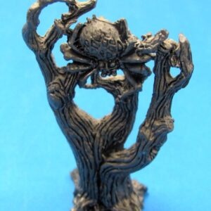 pewter figurine spider in dead tree