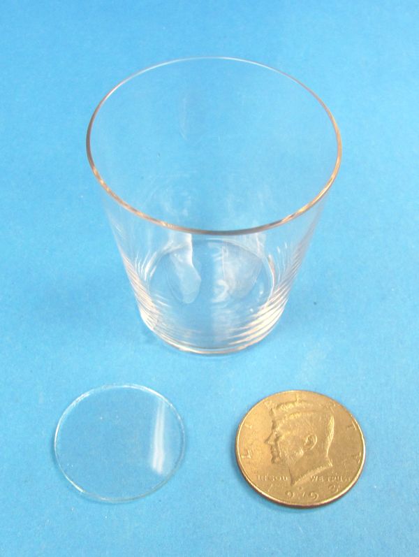 vanishing coin in glass of water with real glass and half dollar